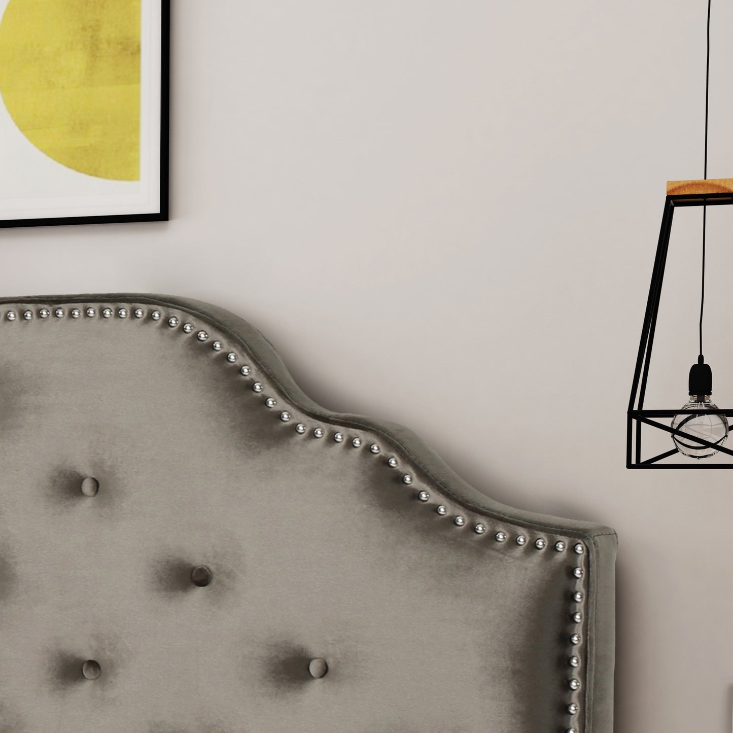 Tufted grey velvet headboard with silver nailhead trim