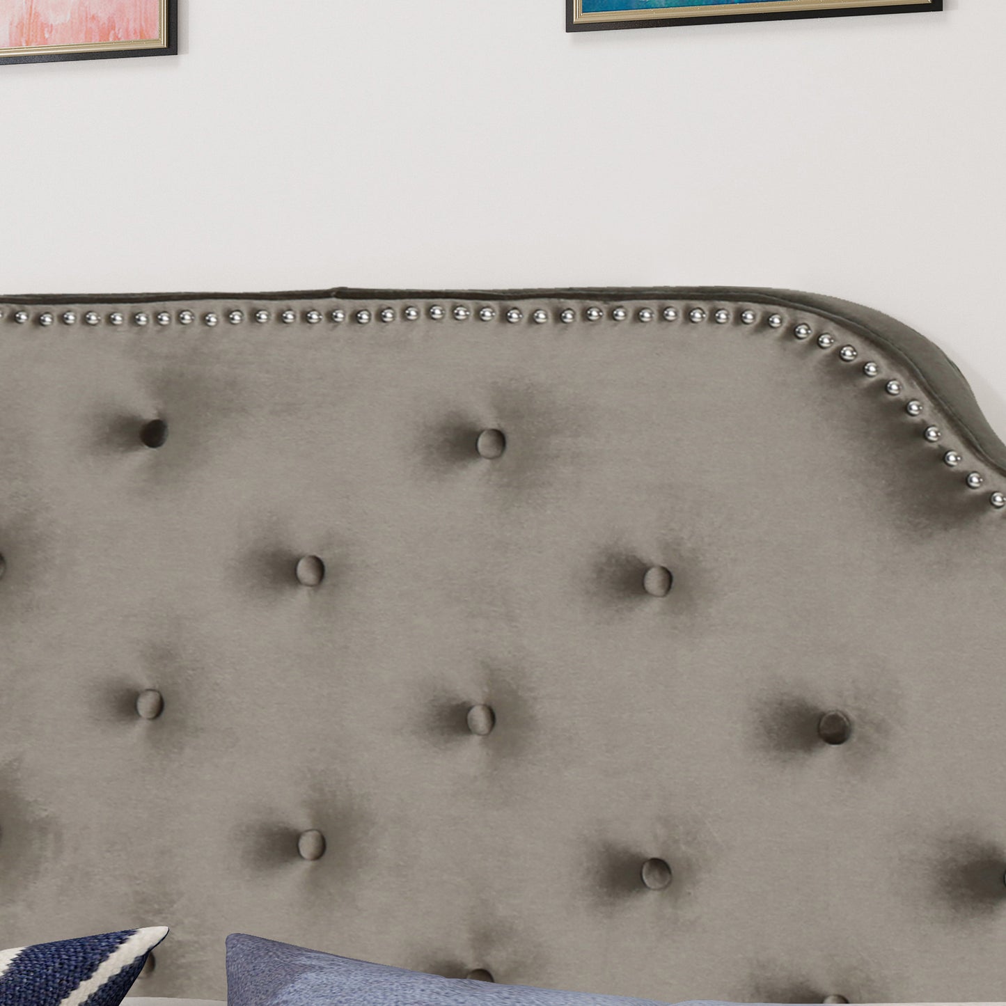 Grey velvet tufted headboard with silver nailhead trim
