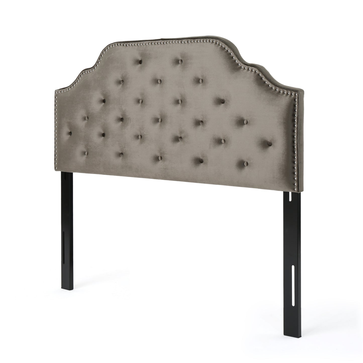 Tufted grey velvet headboard with silver nailhead trim and black metal legs
