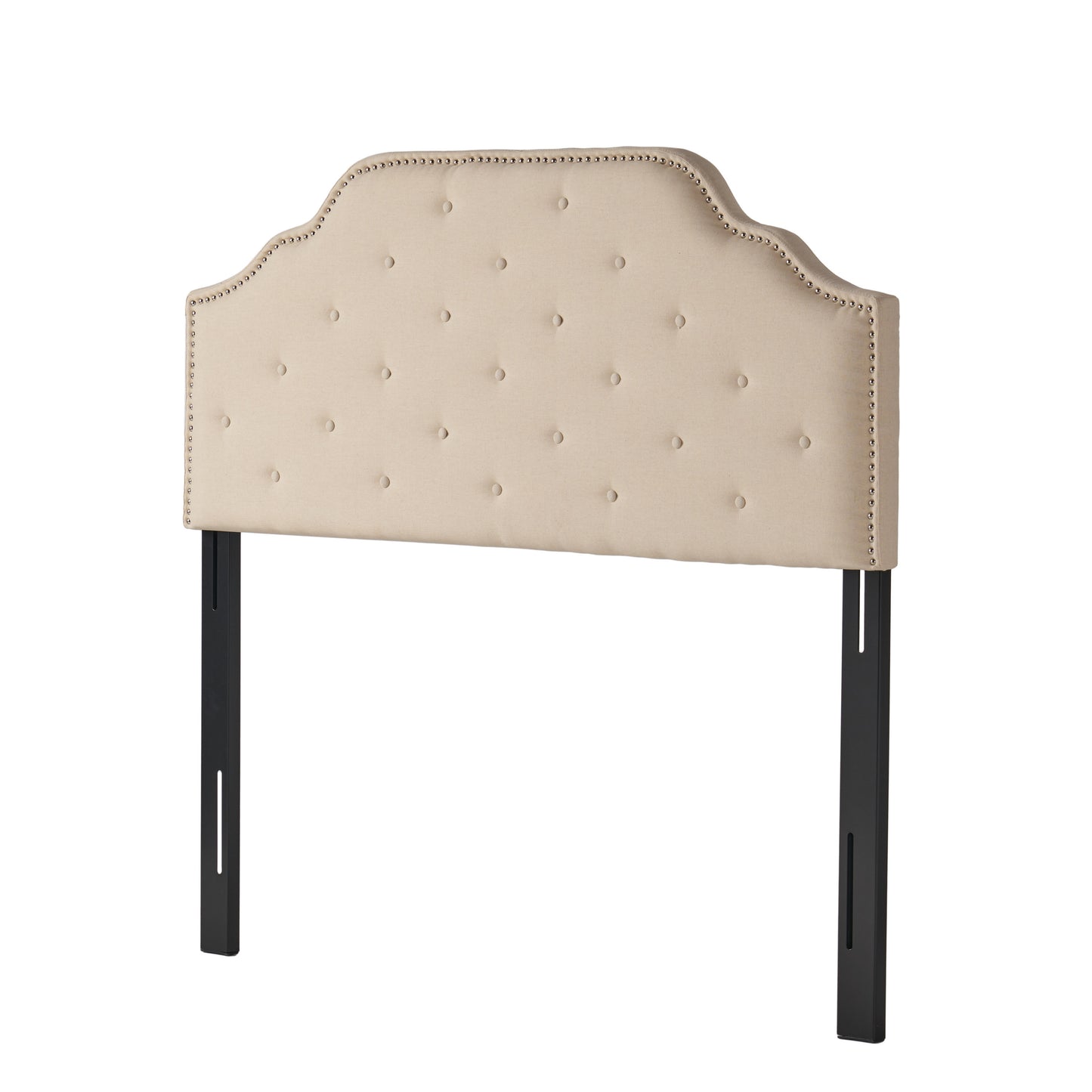 Tufted beige fabric headboard with silver nailhead trim and black metal legs