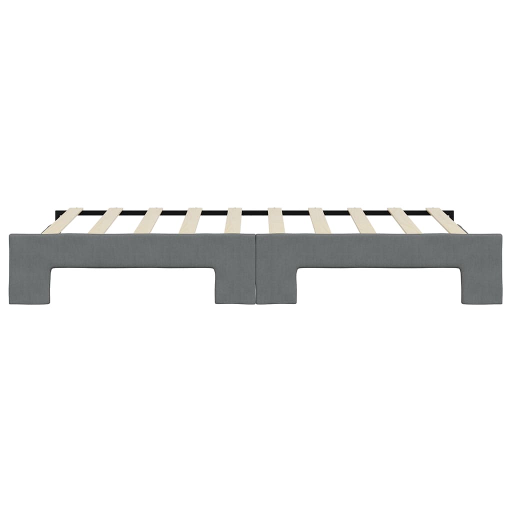 Grey upholstered twin bed frame with wooden slats