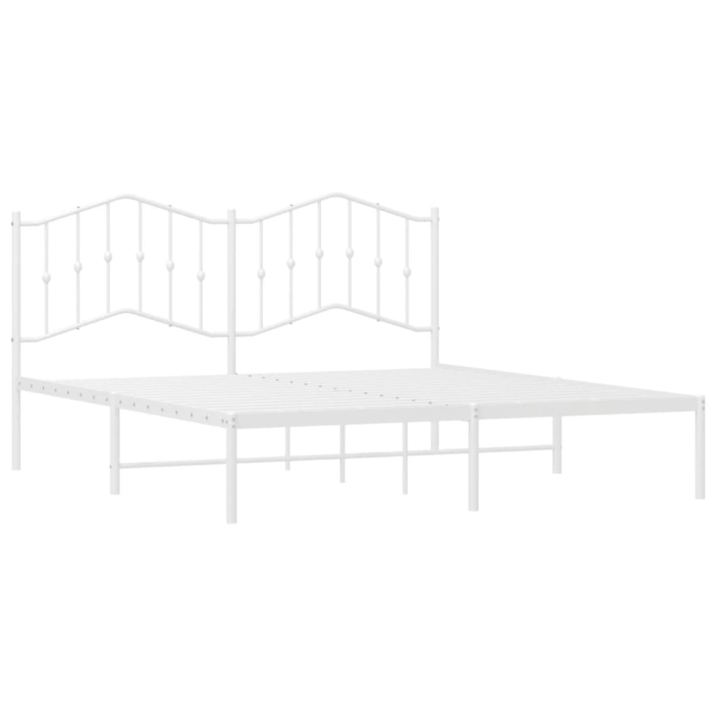White metal twin bed frame with rounded finials and classic arched headboard