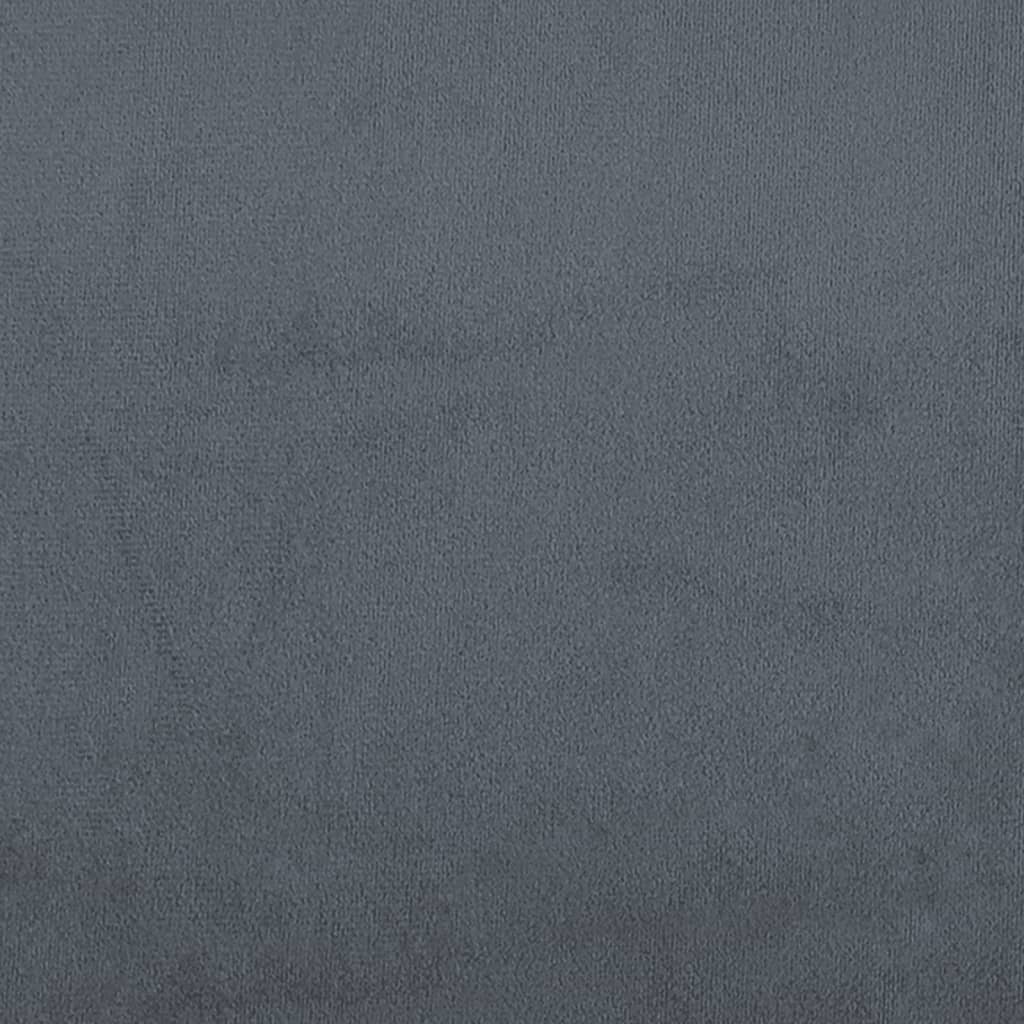 Closeup of a dark grey upholstered bed frame corner with a black cylindrical leg