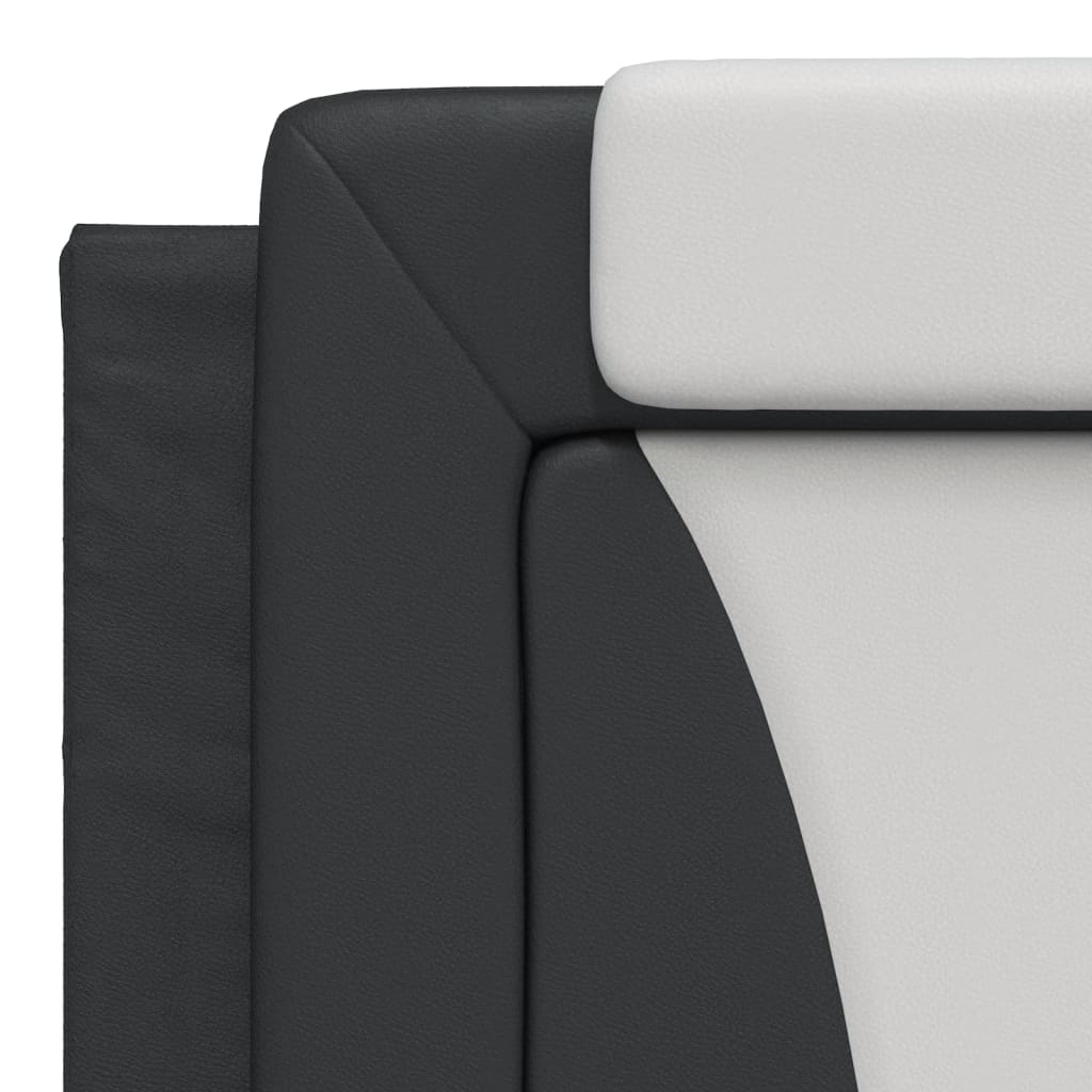 Black twoseater sofa with white cushions