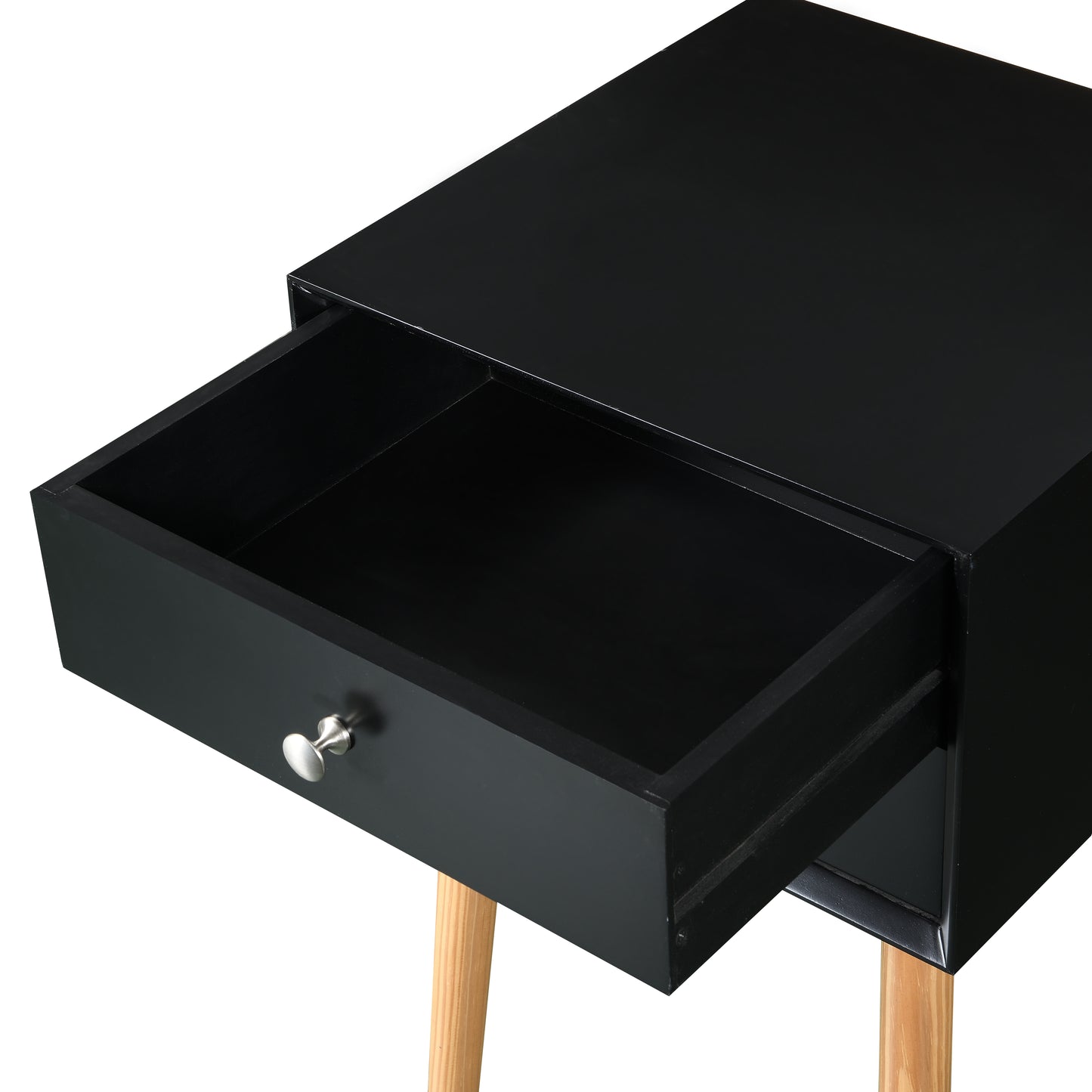 Black bedside table with tapered wooden legs and one open drawer
