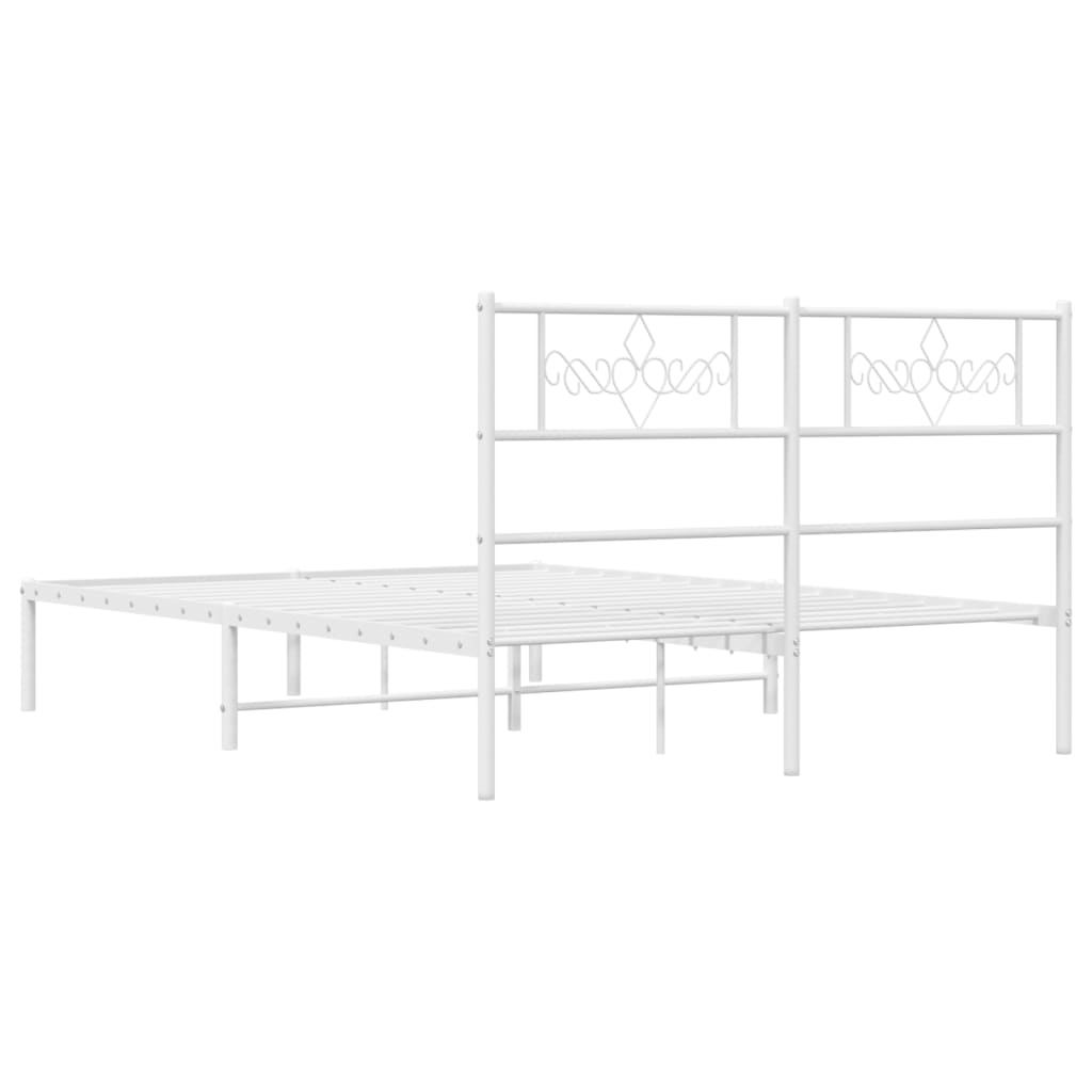 White metal bed frame with decorative headboard and mattress