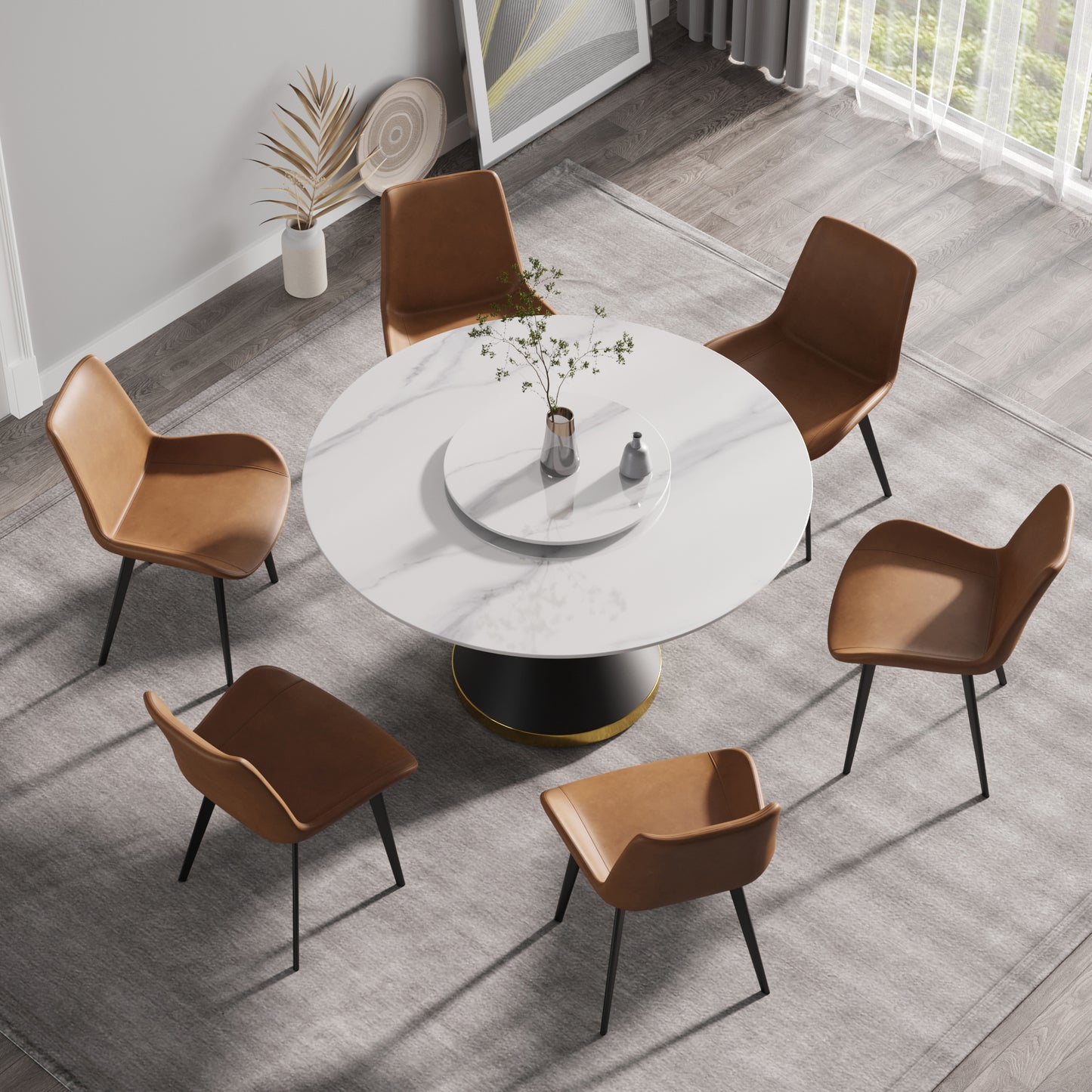 Round marble dining table with tan leather chairs