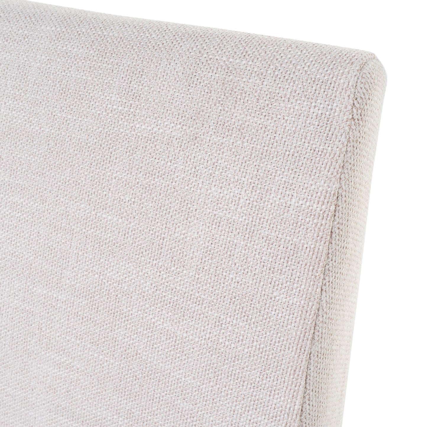 Close up of a textured beige fabric upholstery on a chair