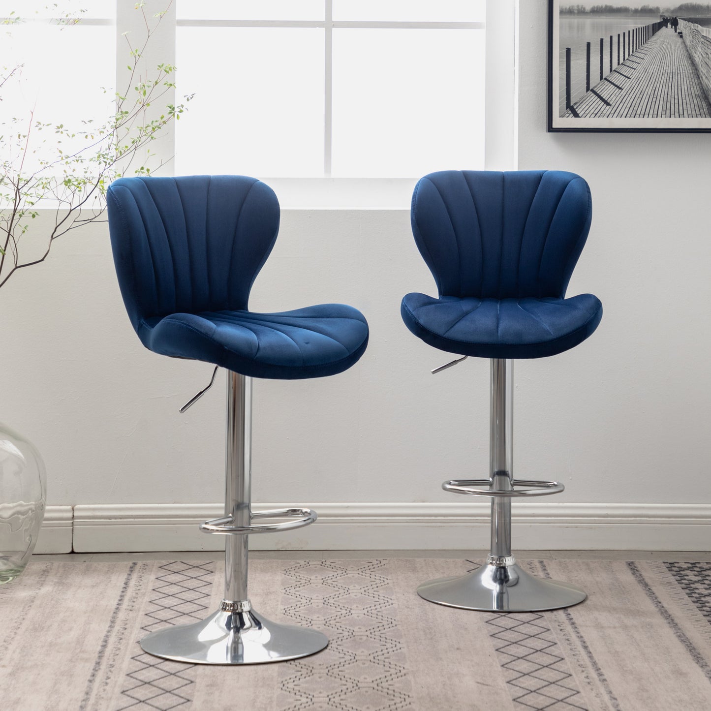 Deep blue velvet bar stool with pleated design and chrome base