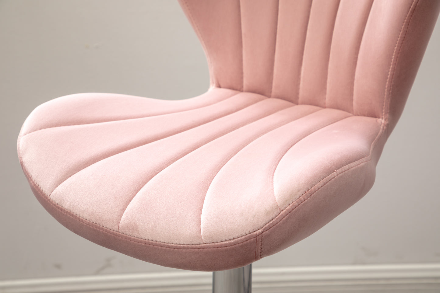 Plush pink velvet accent chair seat with channel tufting