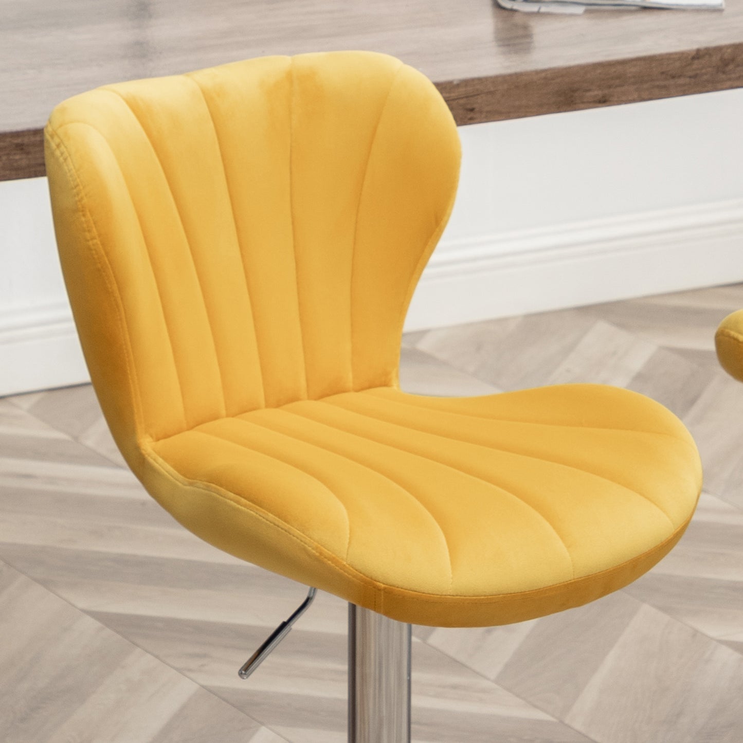 Yellow velvet tufted bar stool with adjustable chrome base