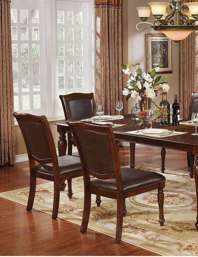 Dark brown leather dining chair with ornate wooden frame