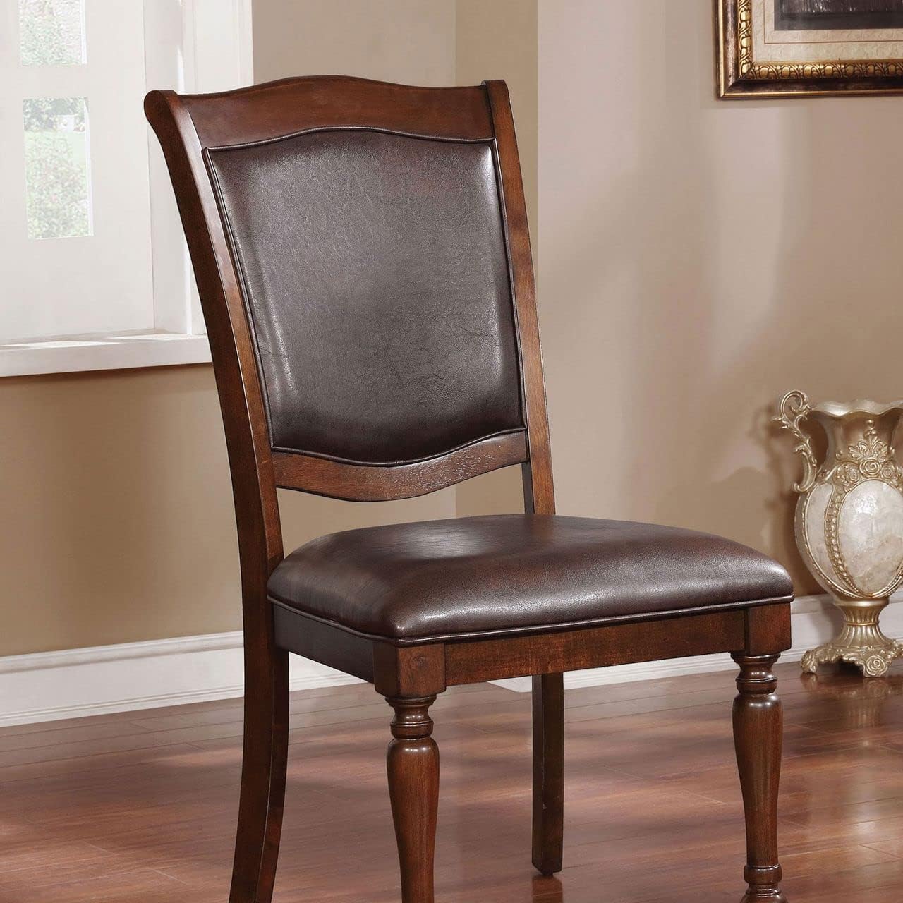 Classic dark wood dining chair with upholstered leather seat and back