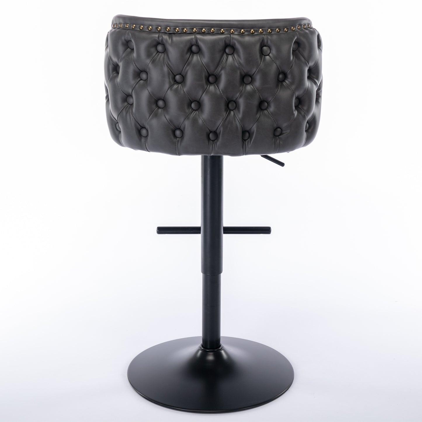 Dark gray tufted leatherette bar stool with brass nailhead trim and black adjustable base