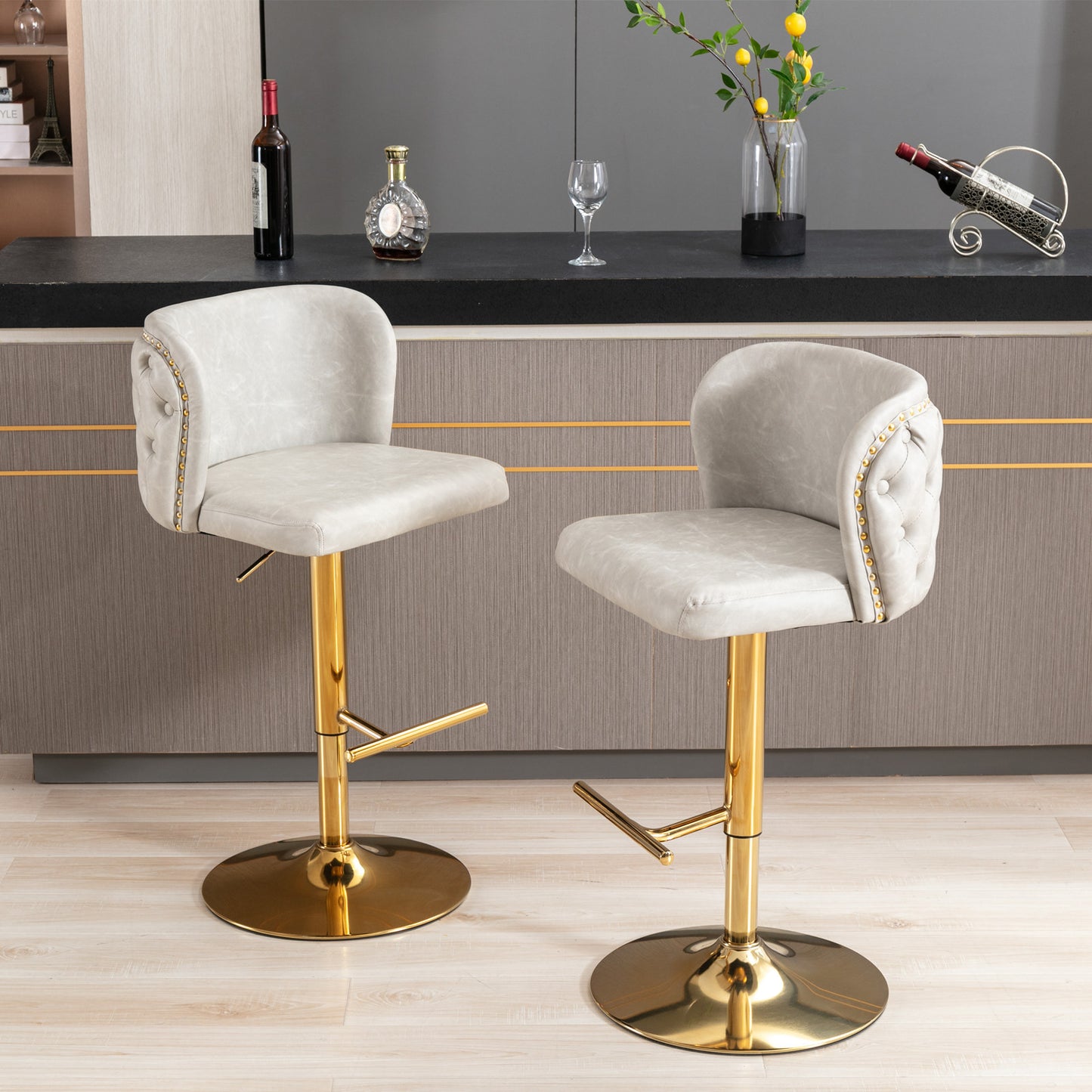 Tufted grey velvet bar stool with gold base and adjustable height