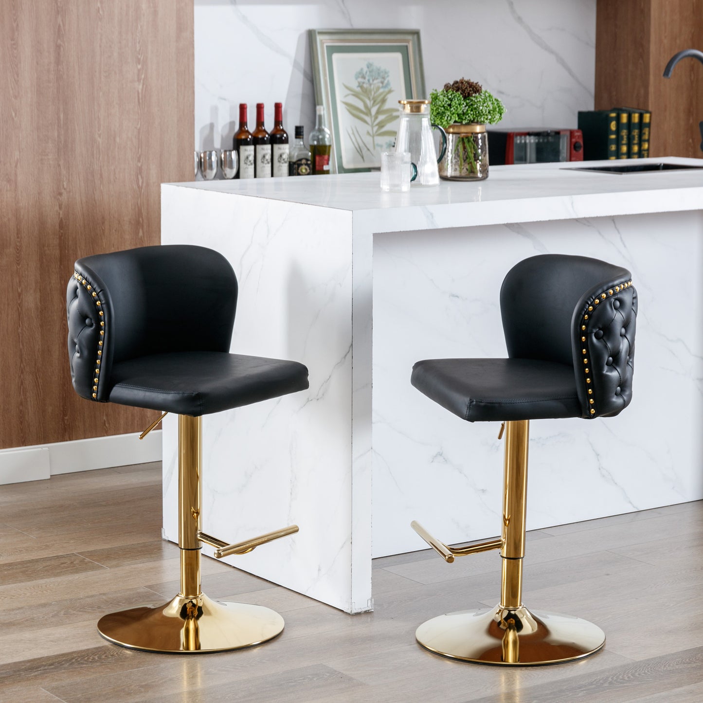 Black tufted leather bar stool with gold base and accents