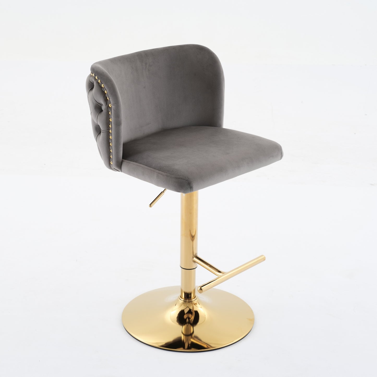 Grey velvet tufted bar stool with gold base and nailhead trim
