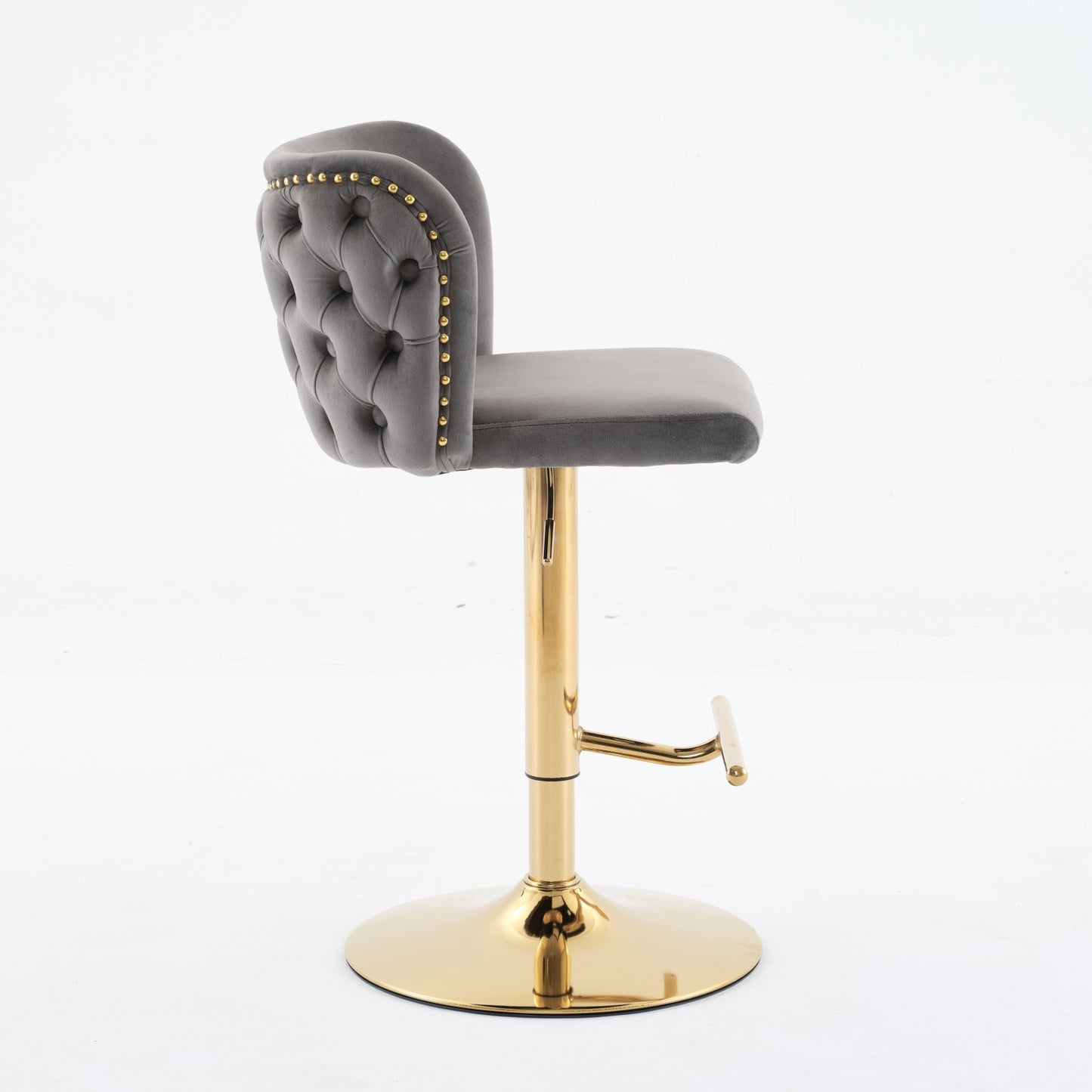 Tufted grey velvet bar stool with gold legs and accents