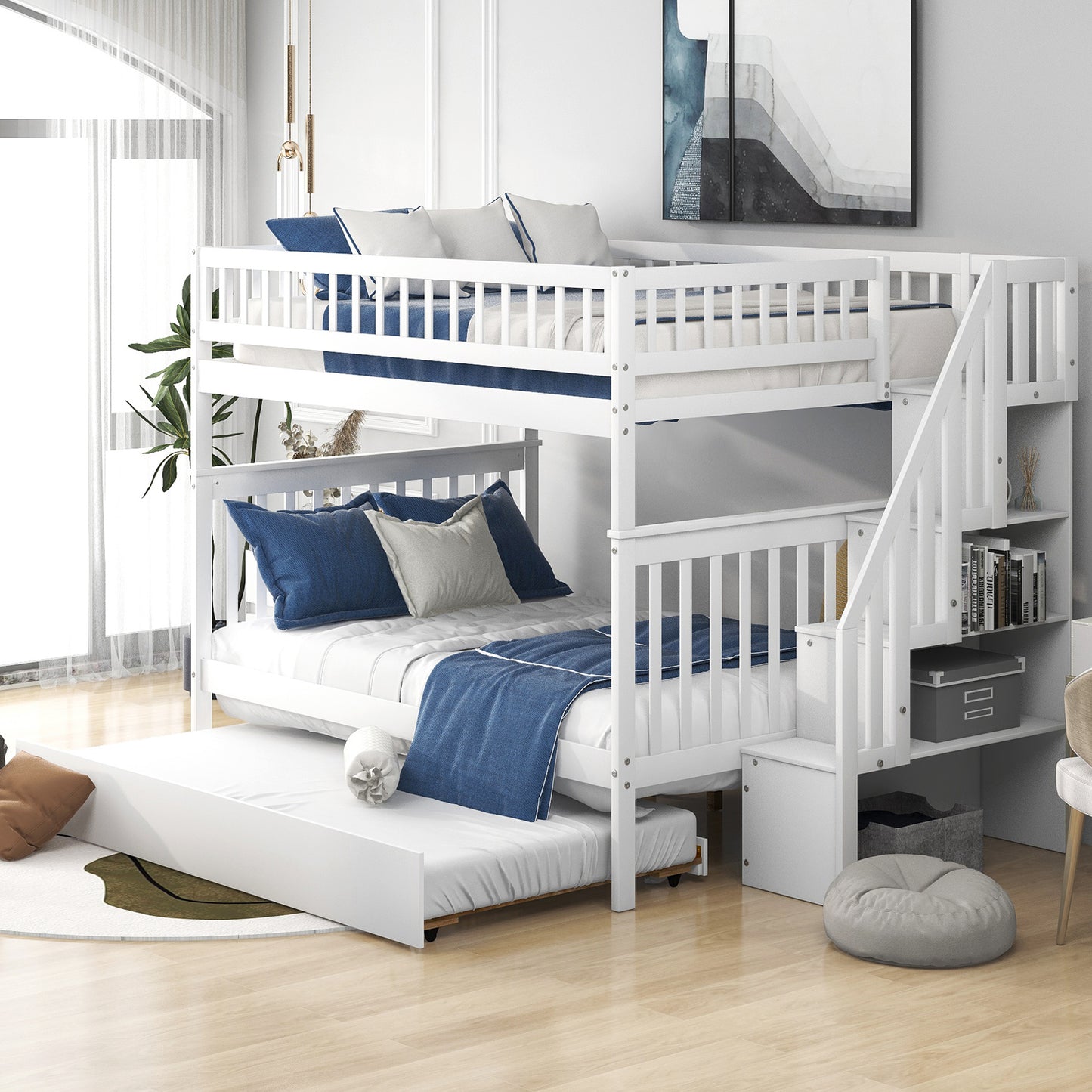 White wooden triple bunk bed with pullout trundle navy bedding and storage stairs