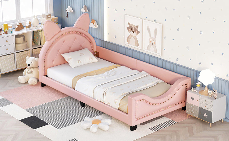 Pink upholstered twin bed with cat ear headboard and tufted details