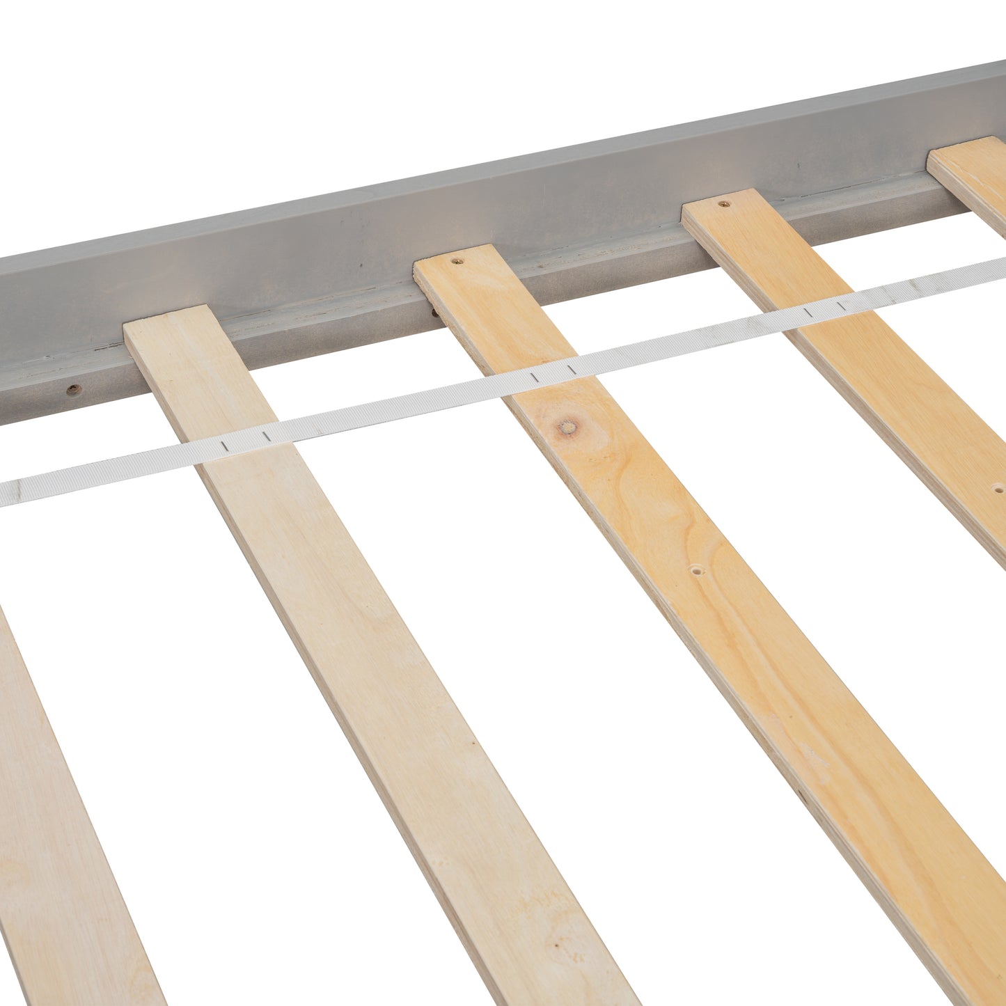 Closeup of grey bed frame with natural wood slats and white support strap
