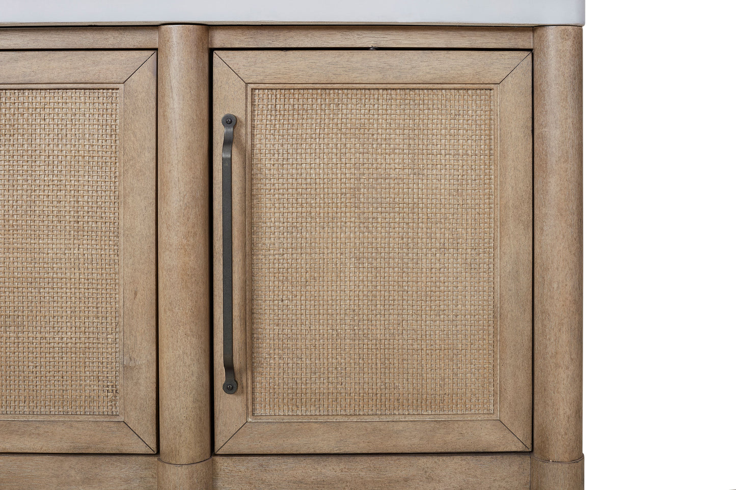 Light brown wood cabinet with woven cane panel doors and dark metal hardware
