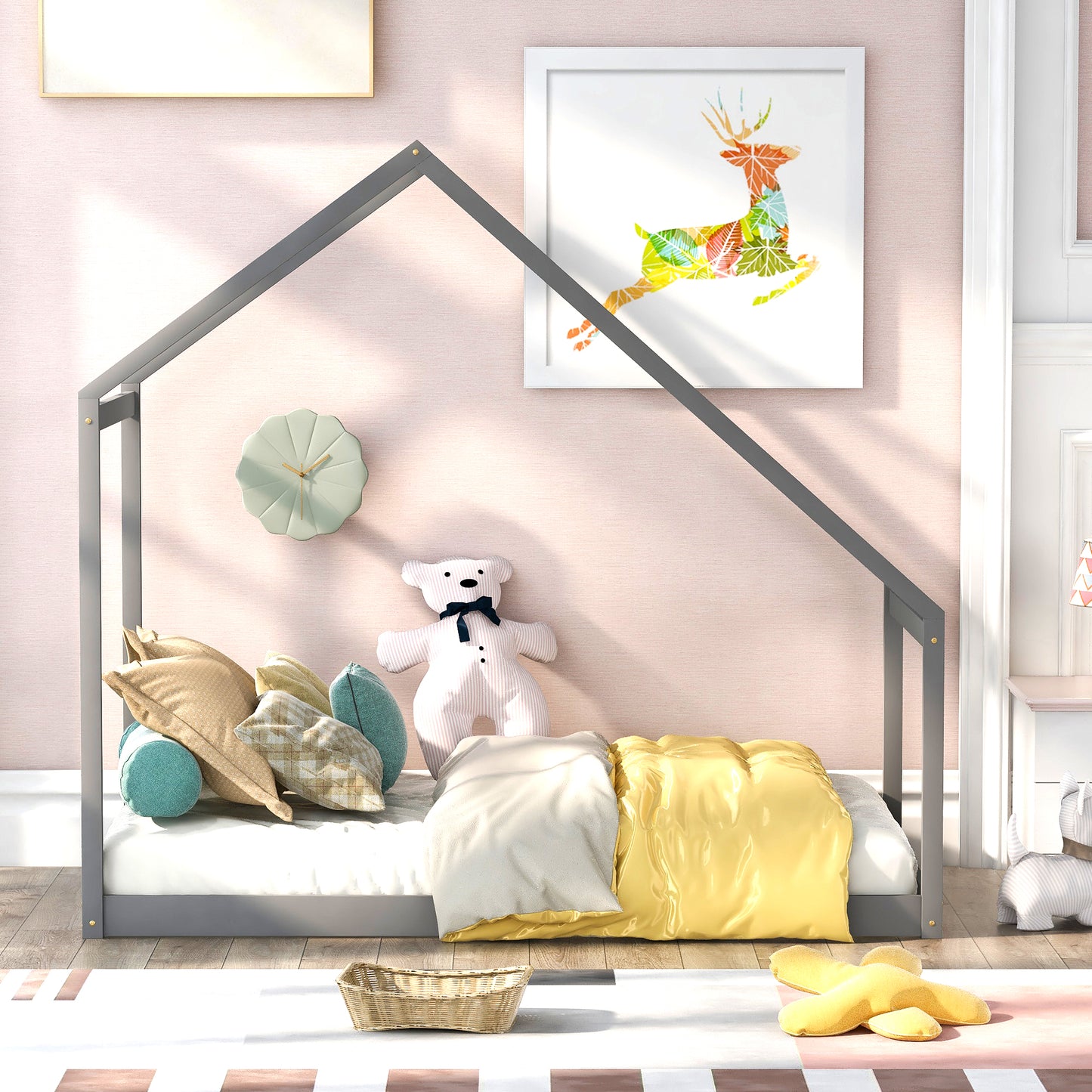 Gray wooden house frame toddler bed with colorful patterned deer art