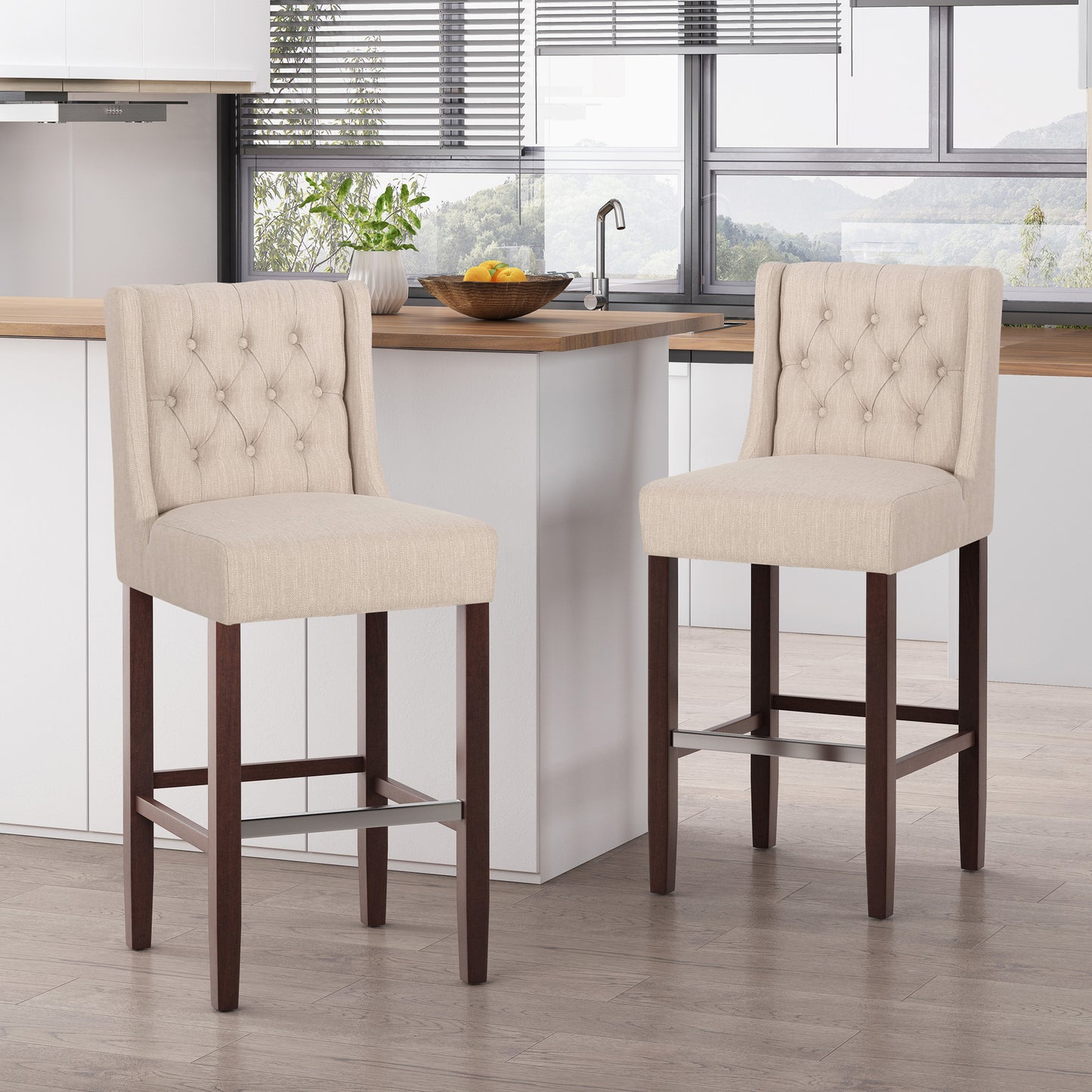 Two beige tufted bar stools with dark wood legs
