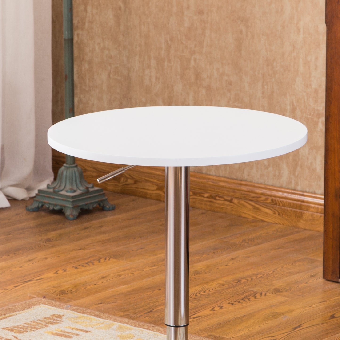 White circular counter height table with chrome adjustable pedestal base
