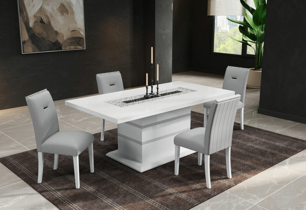 Modern white dining table with silver accents and four grey upholstered chairs