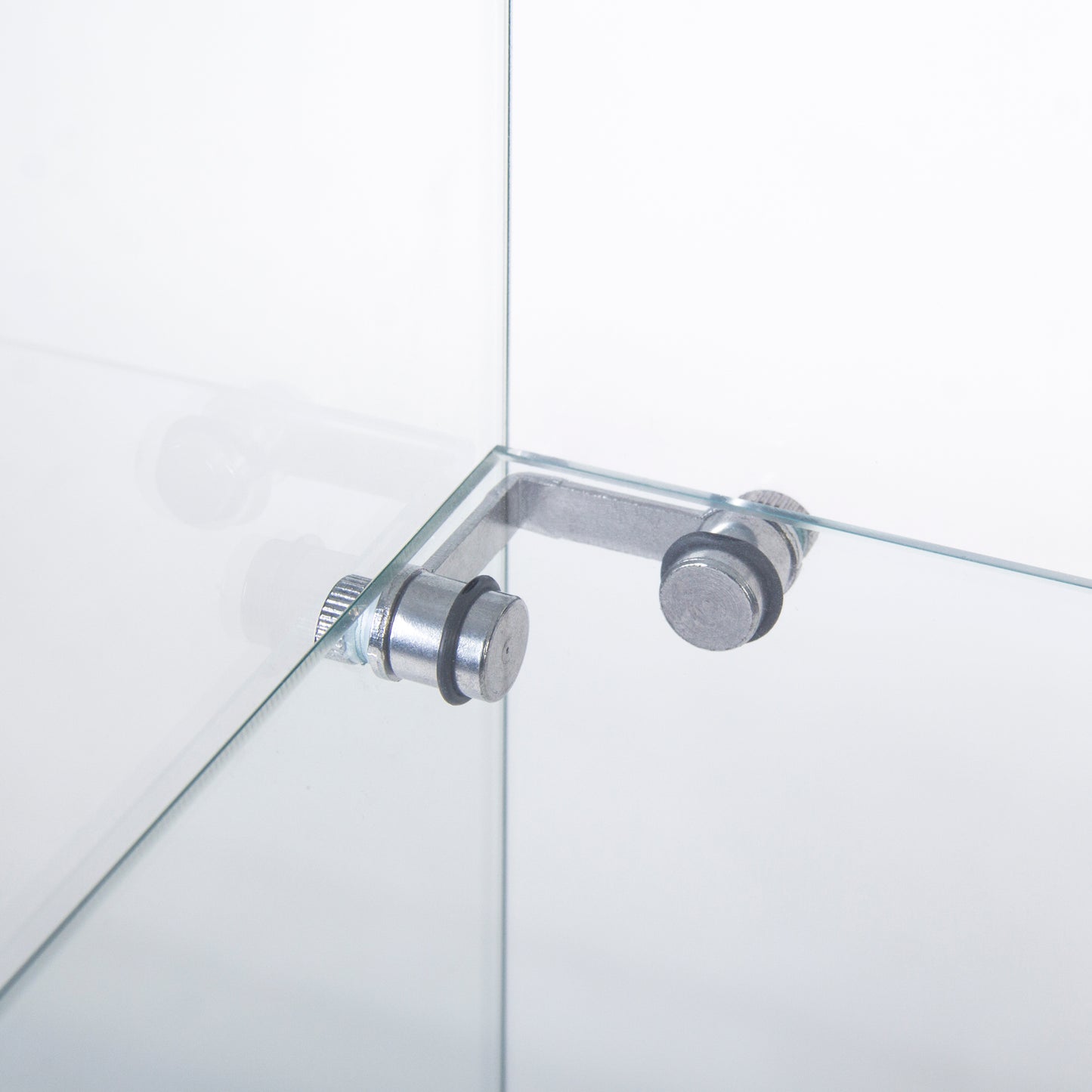 Closeup of a silver metal Lbracket securing two clear glass panes