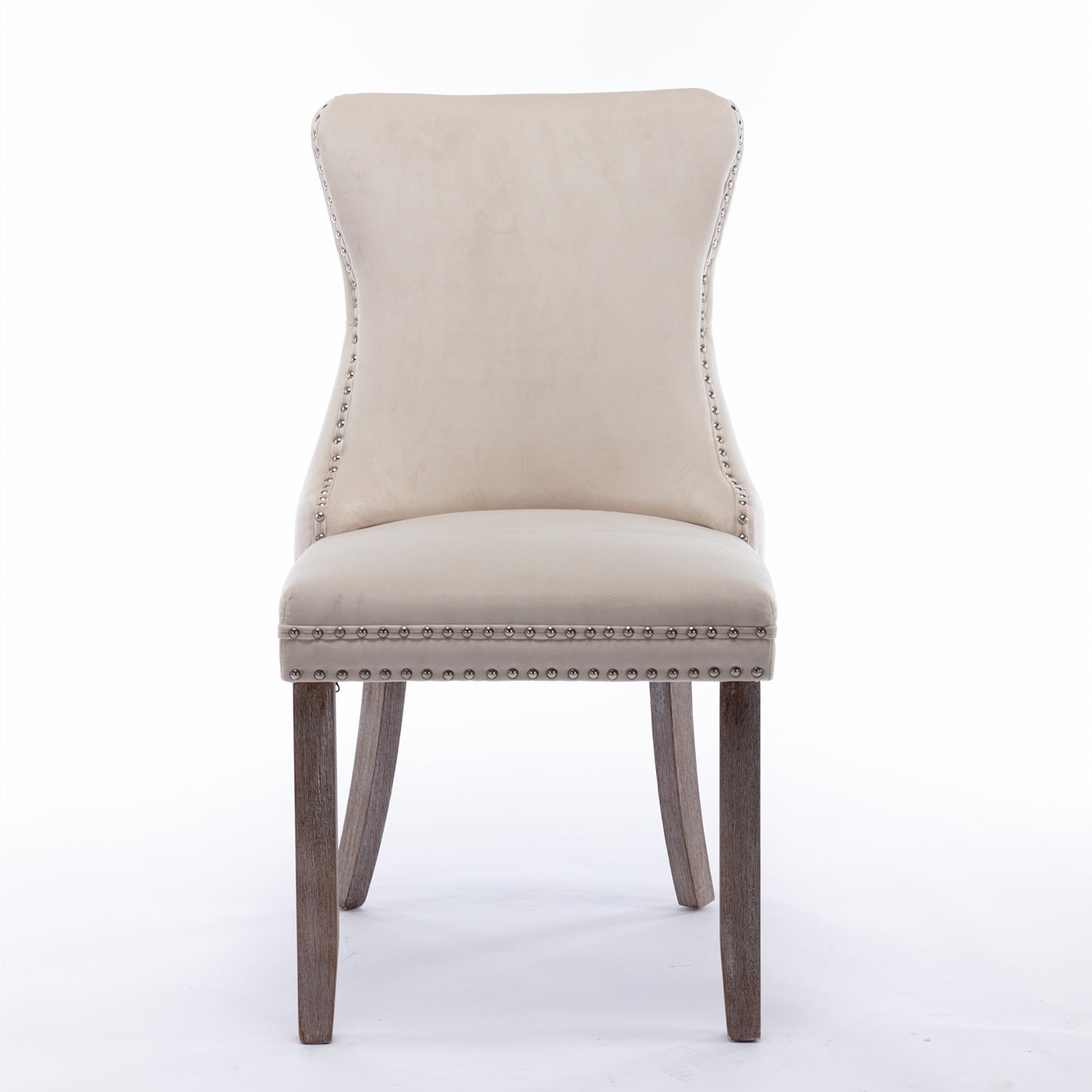 Tufted beige velvet dining chair with silver nailhead trim and wooden legs