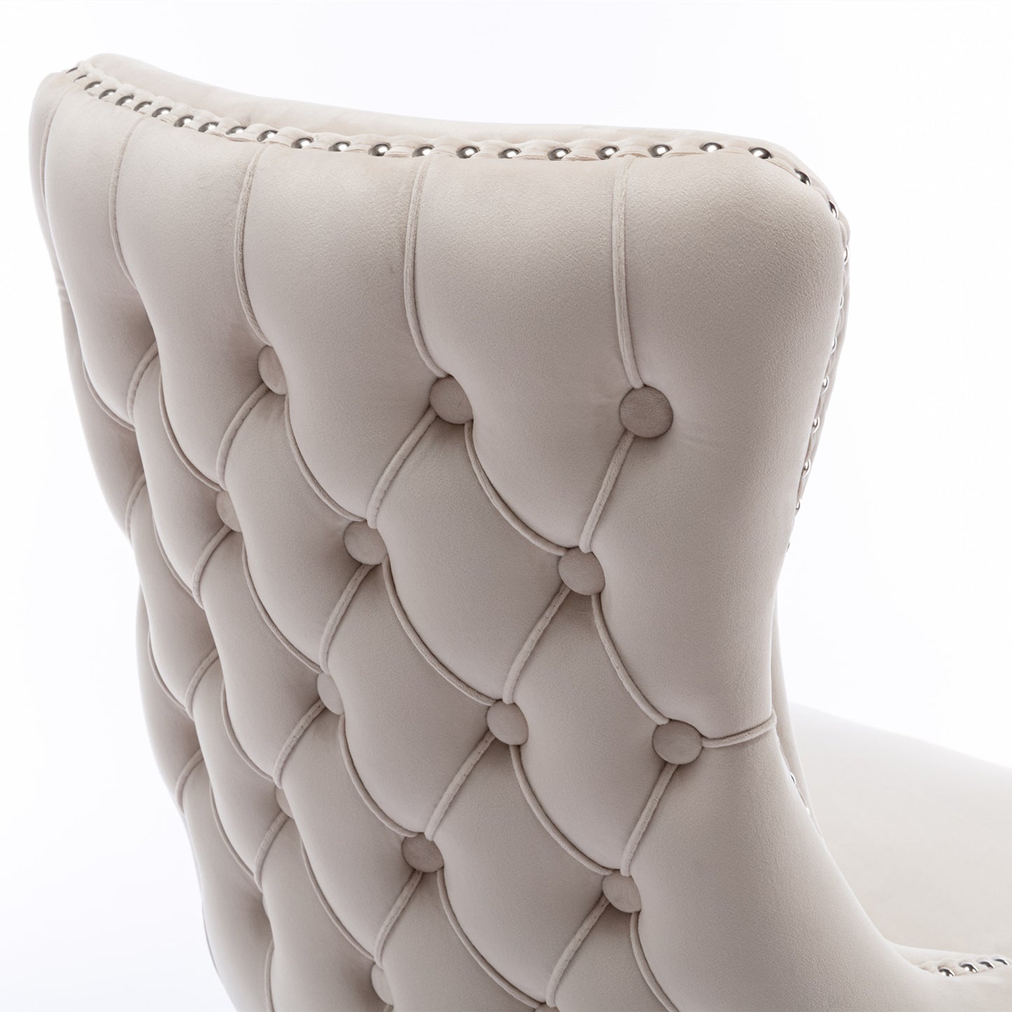 Beige velvet tufted dining chair with silver nailhead trim