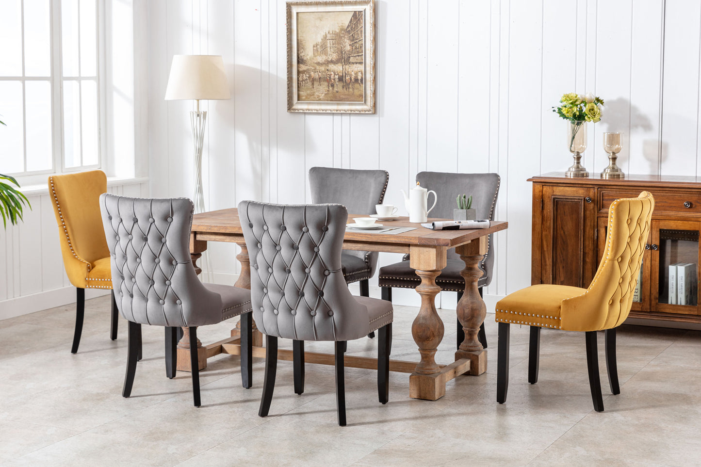 Tufted grey velvet dining chair with studded trim