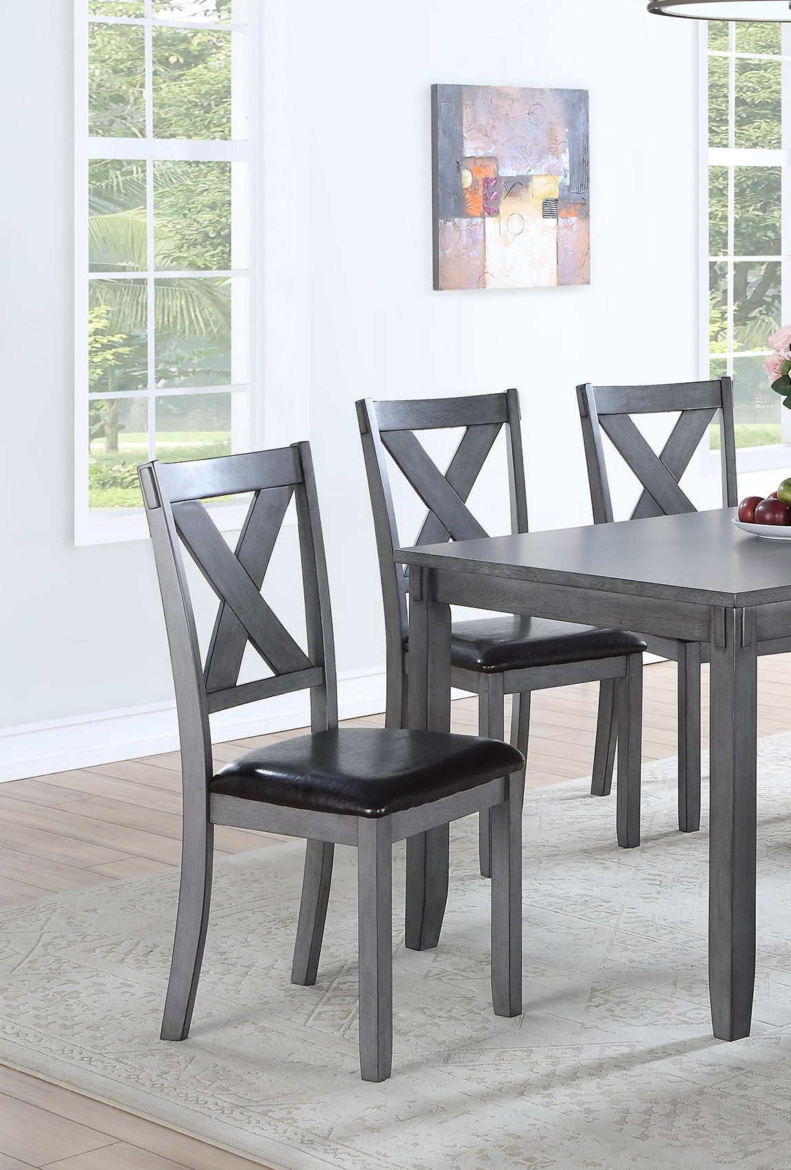Gray dining chair with Xback detail and dark leather seat