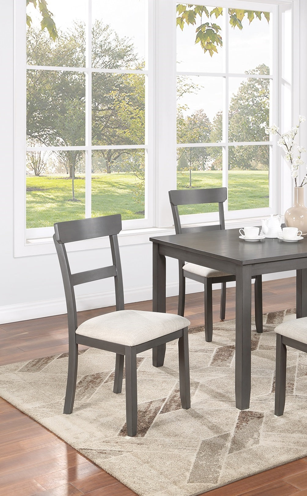 Gray wooden dining chair with light beige upholstered seat