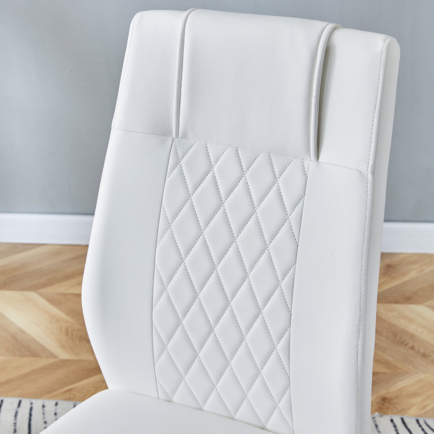 White faux leather office chair with diamond stitching detail
