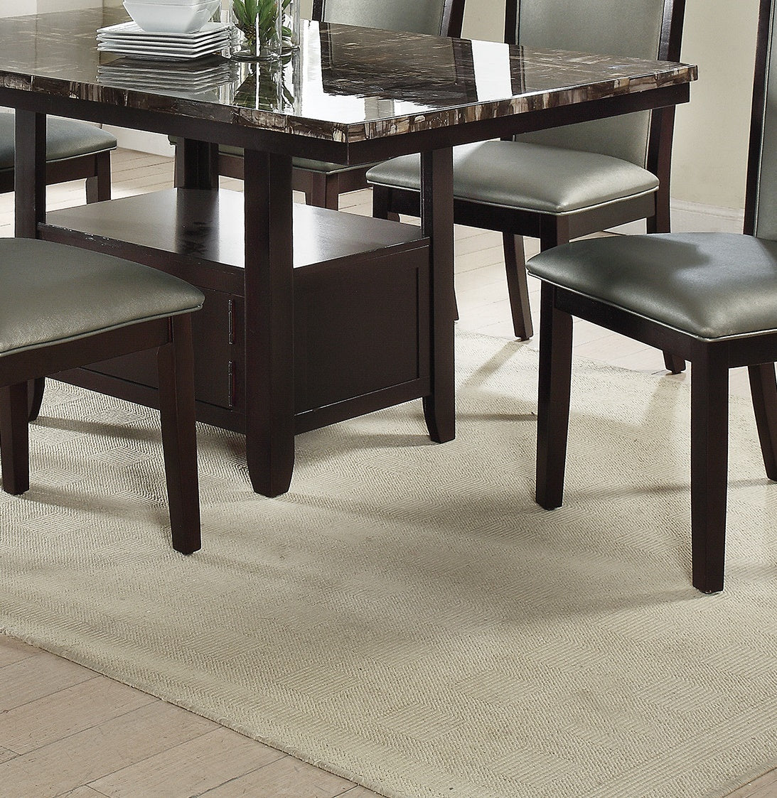 Dark brown wood dining table with faux marble top and grey chairs