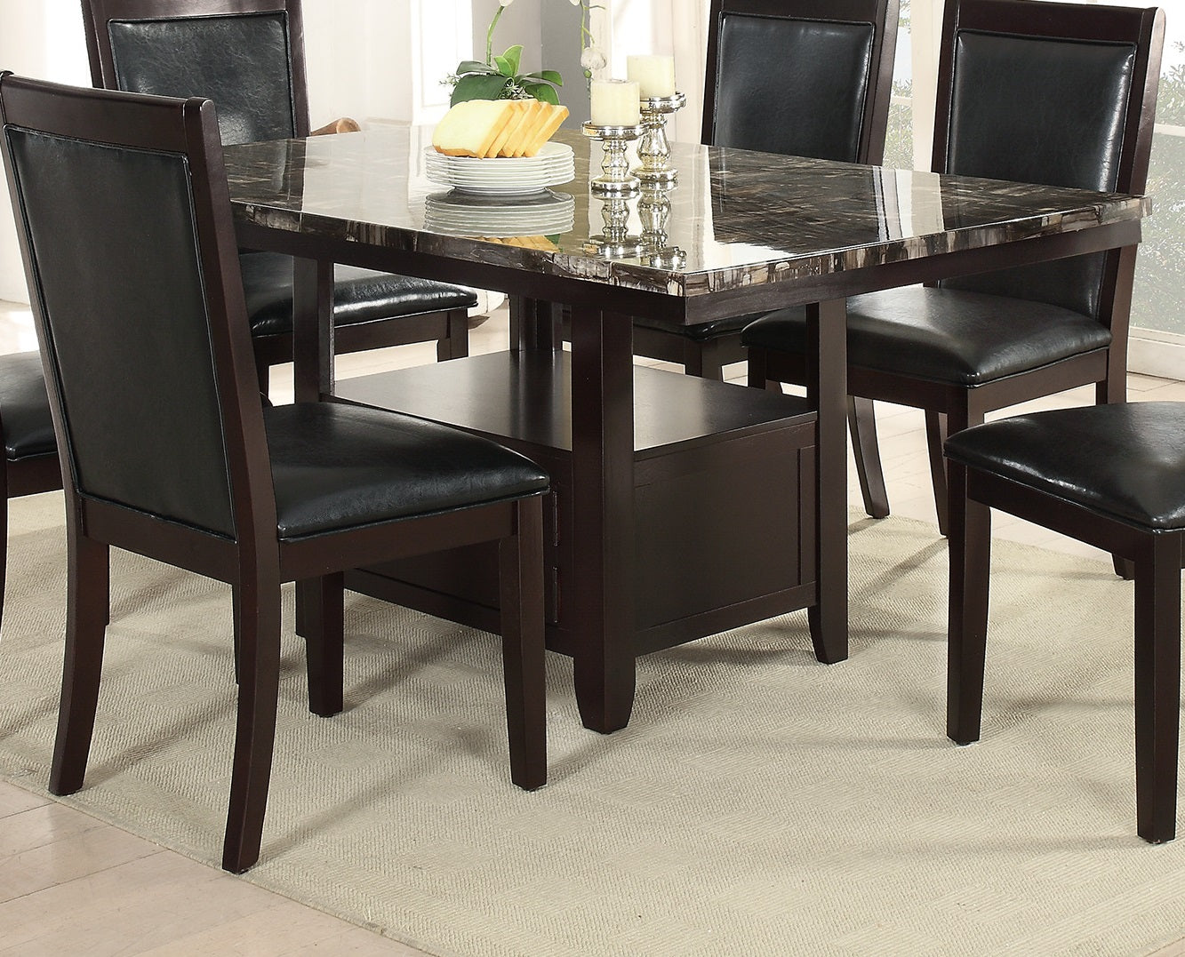 Dark brown wood dining chairs with black faux leather seats