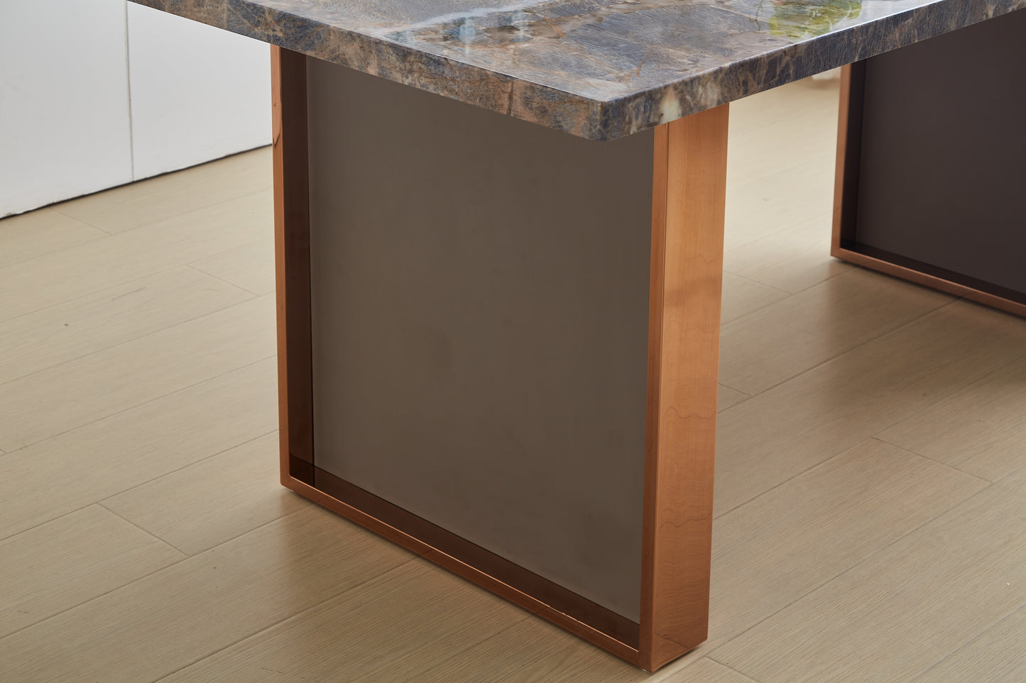 Elegant marble top dining table with coppertoned legs