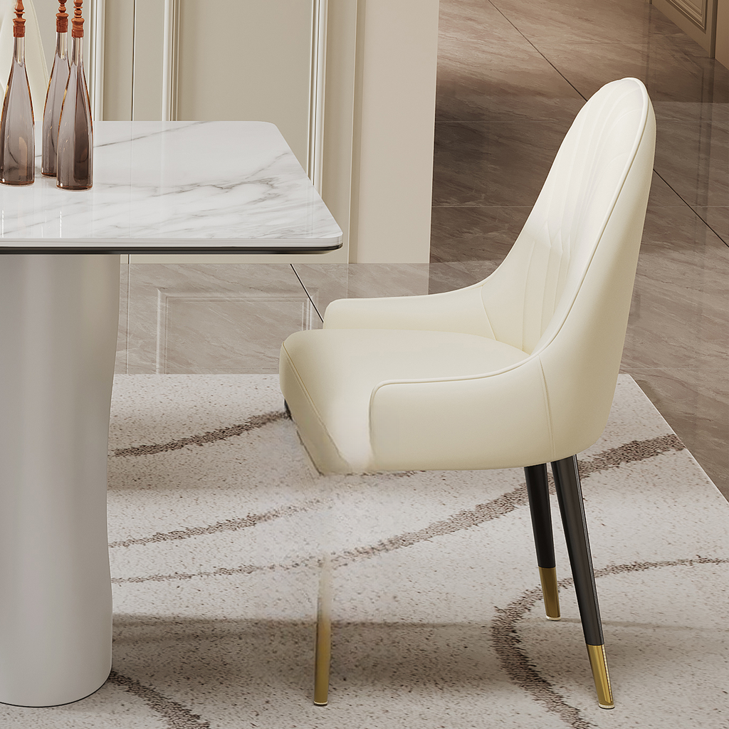 Cream upholstered dining chair with quilted back and goldtipped black legs