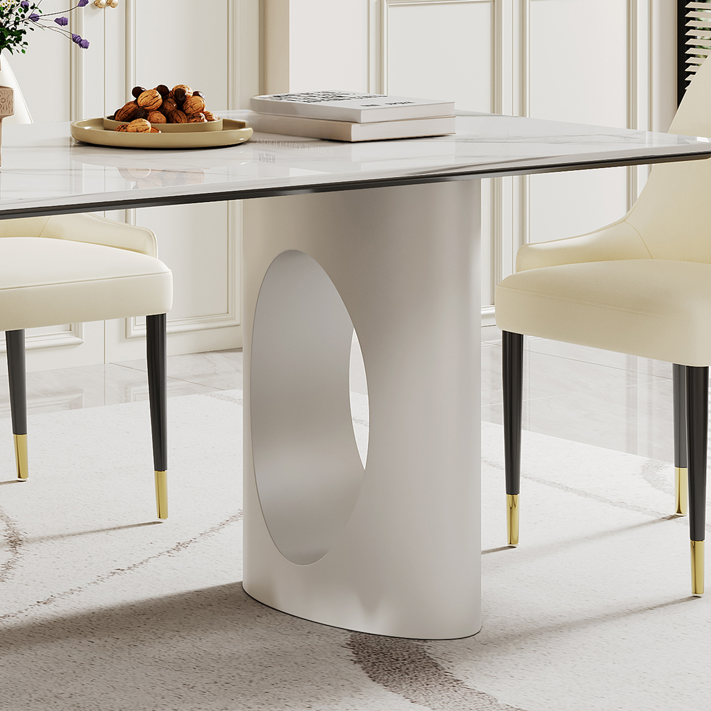 Modern white dining table with oval cutout pedestal base and marblelook top