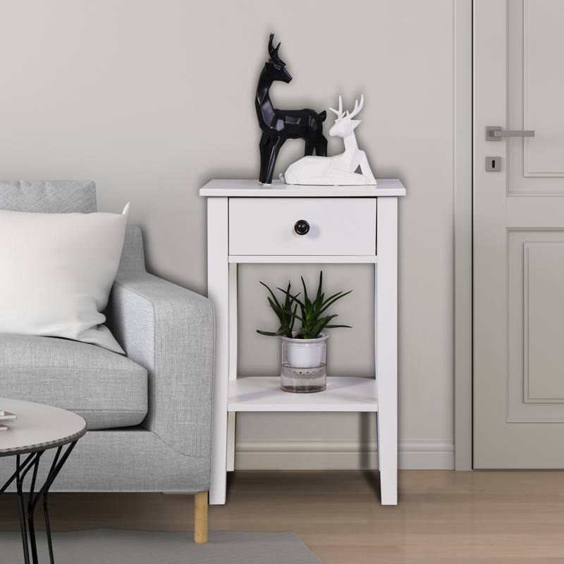 White wooden accent table with drawer and shelf displaying decorative deer sculptures