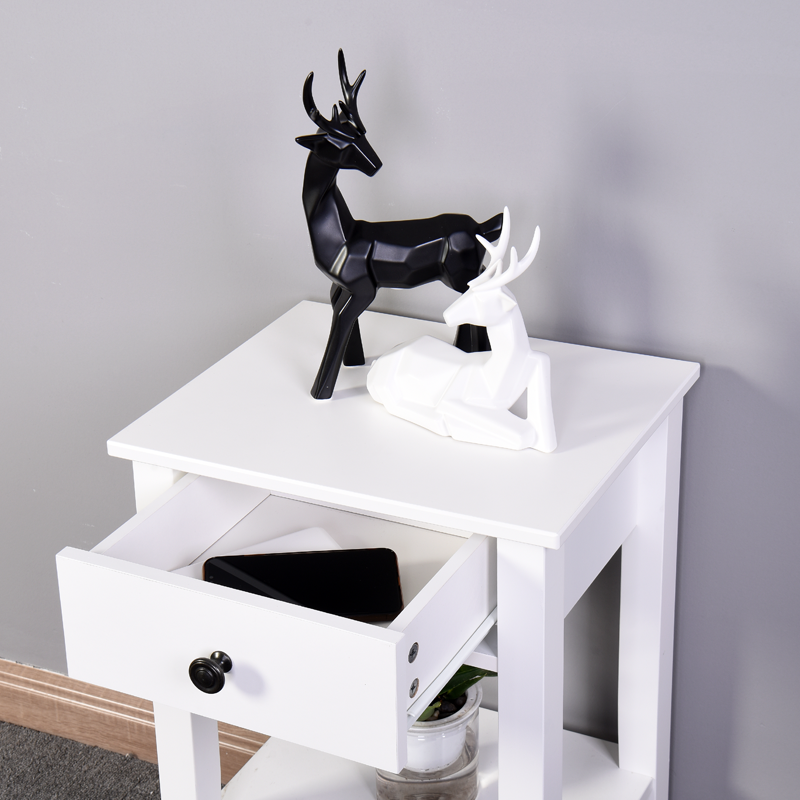 Abstract black deer figurine on white side table