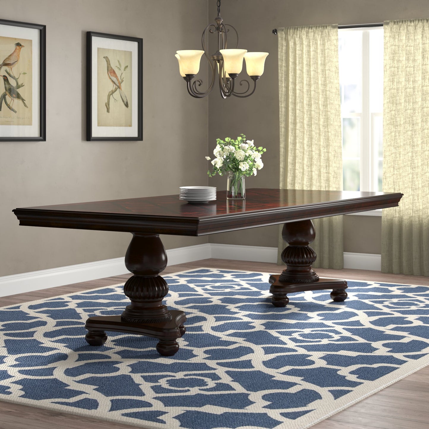 Dark wood dining table with ornate carved legs and intricate inlay tabletop