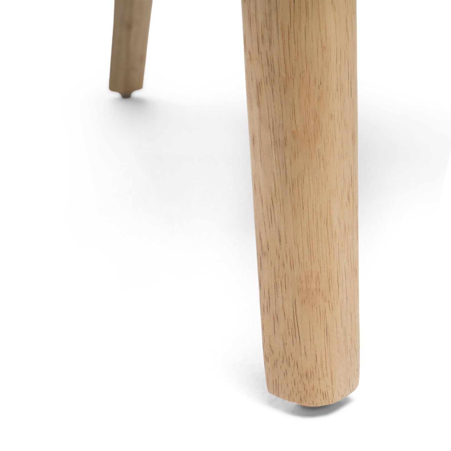 Closeup of tapered natural wood chair leg with visible grain
