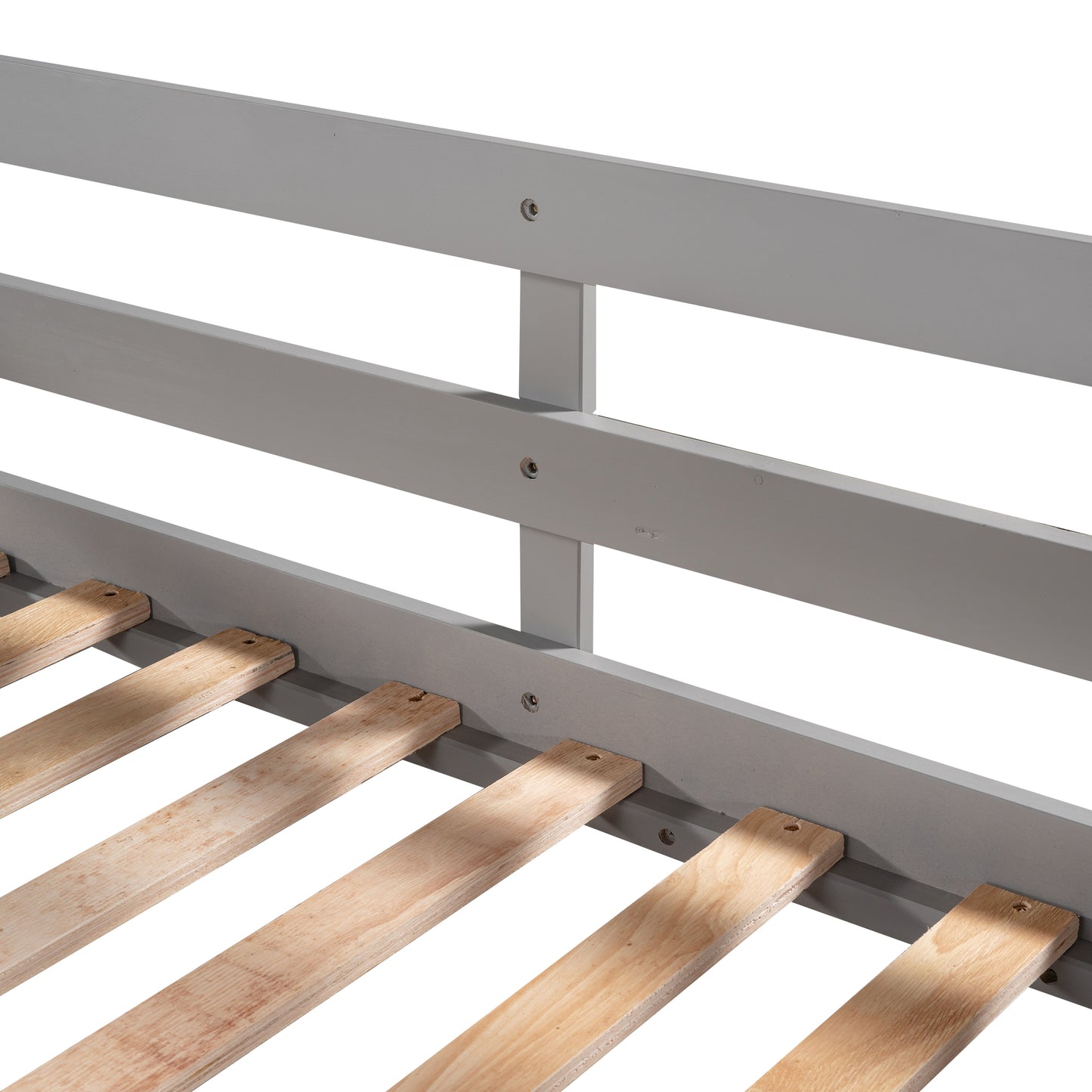Closeup of grey wooden bed frame with pine slats