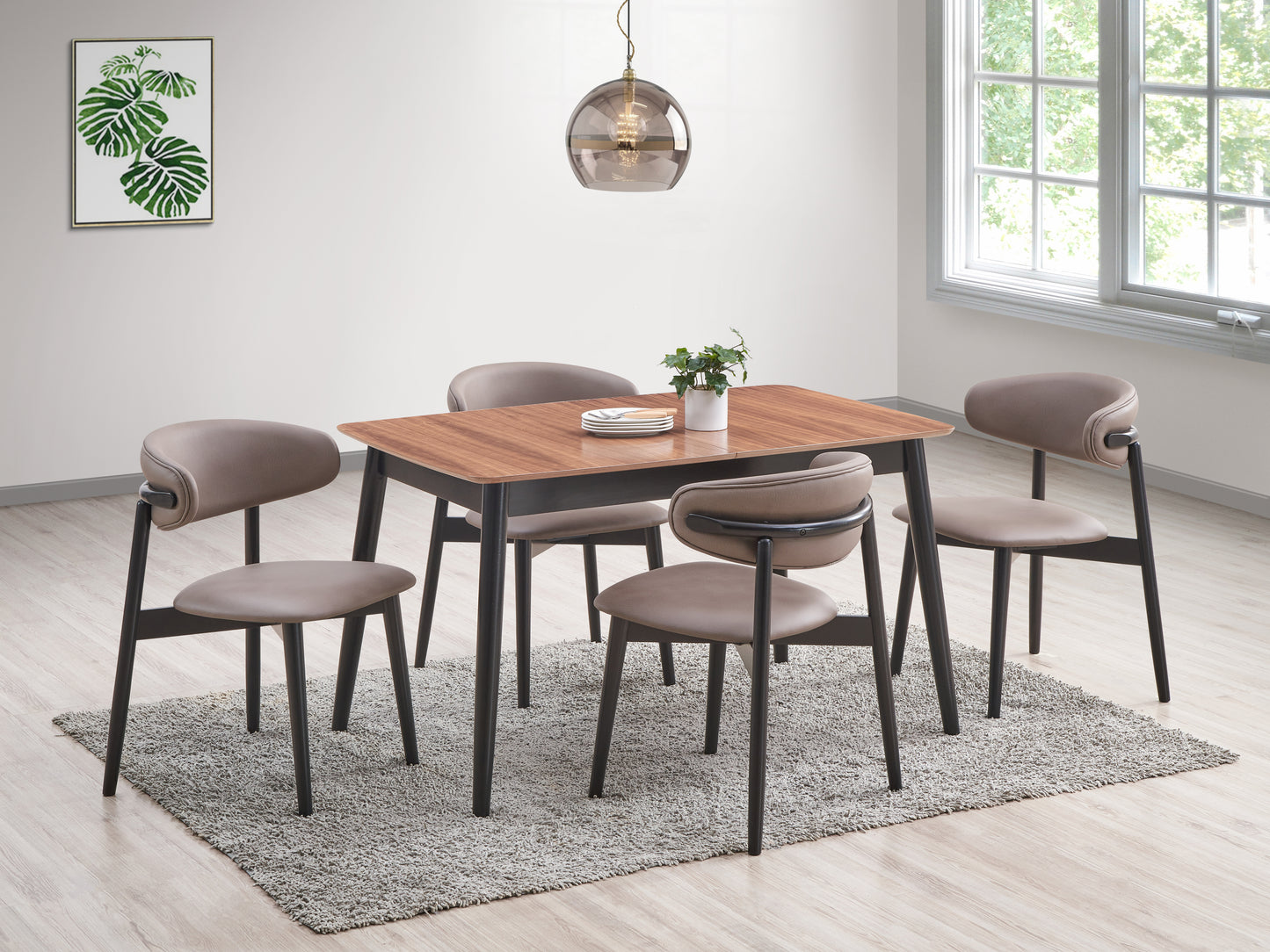 Modern dining table set with four taupe upholstered chairs and a woodgrain tabletop