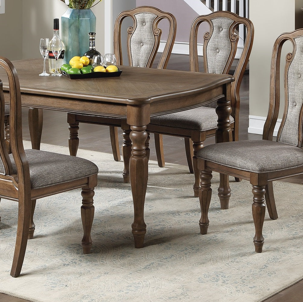 Tufted upholstered dining chairs in gray linen fabric with wooden legs