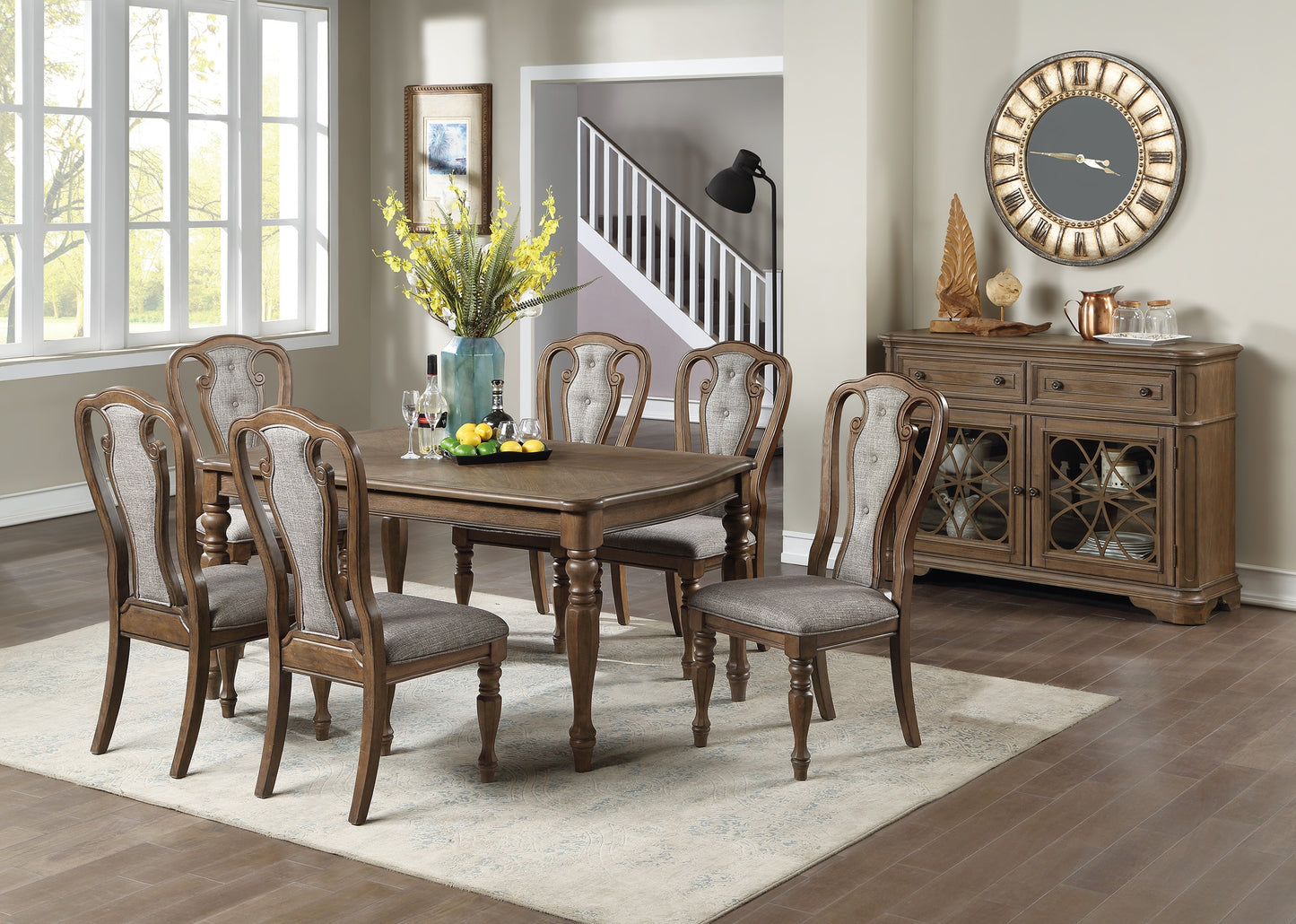 Traditional dining table and six upholstered chairs set in a bright room